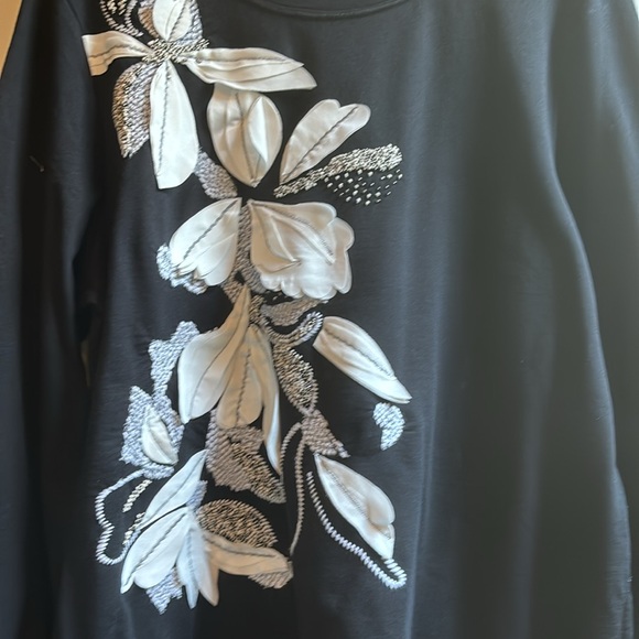 This is an absolutely beautiful blouse never worn. - Picture 2 of 2